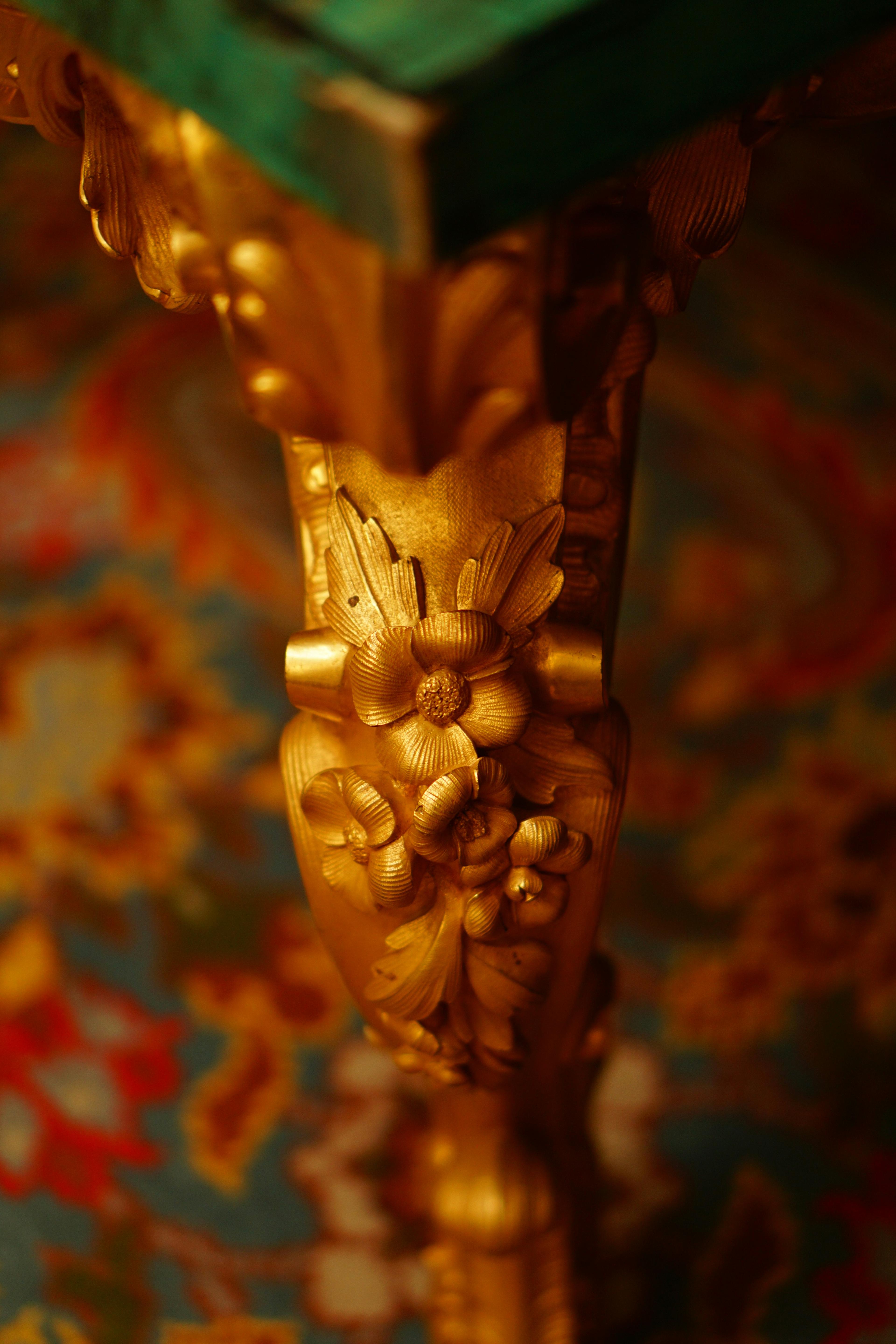 Elegant antique wooden furniture including chairs and tables with ornate carvings